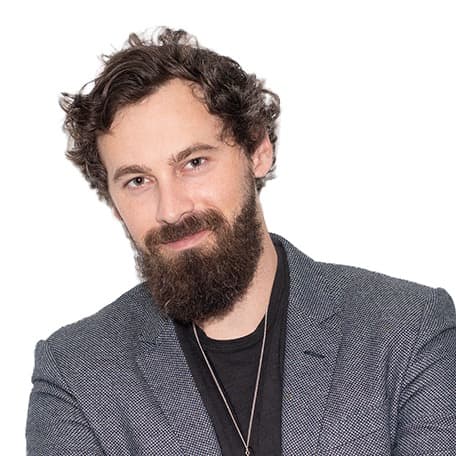 Will Mitchell, blazer, arms crossed: square on a white background