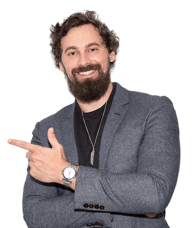 Will Mitchell, in a blazer, smiling and pointing at the form