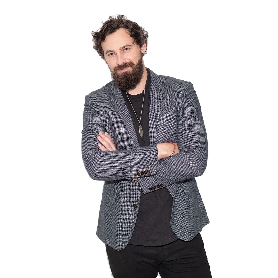 Will Mitchell, blazer, arms crossed: full frame on a white background